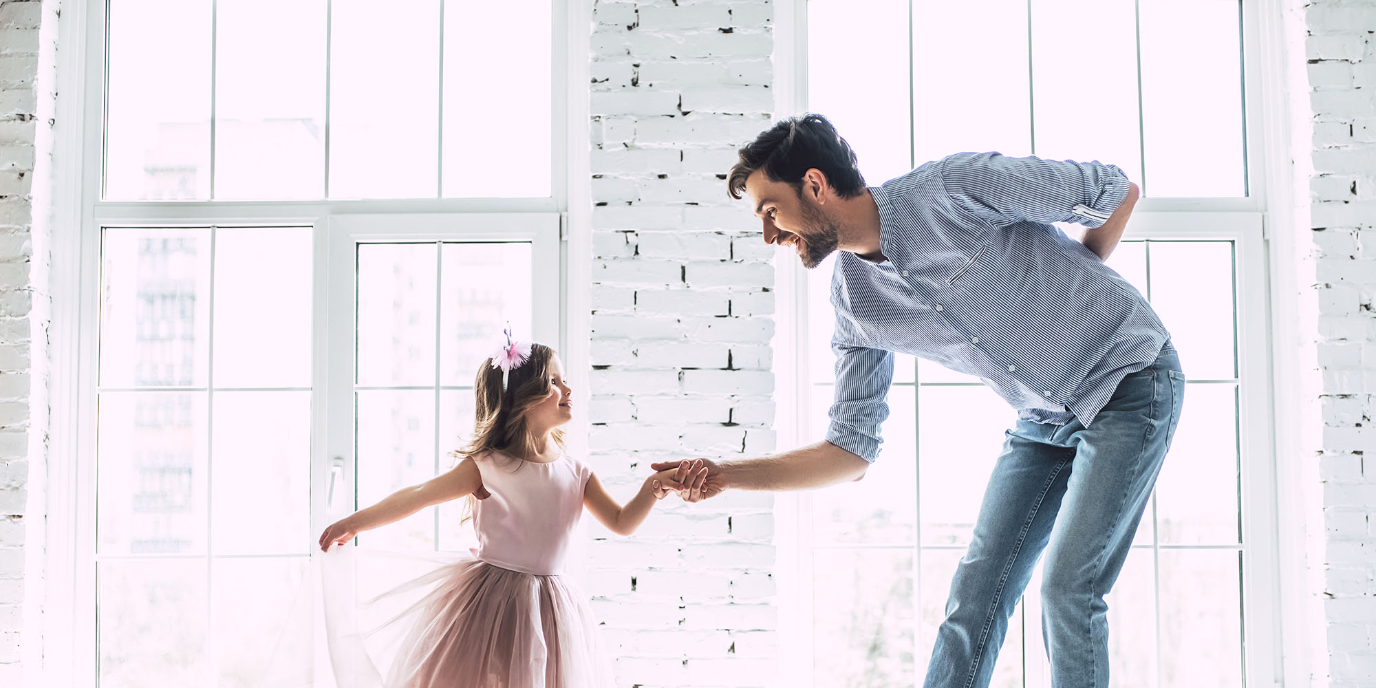 Father and Young Daughter Dancing